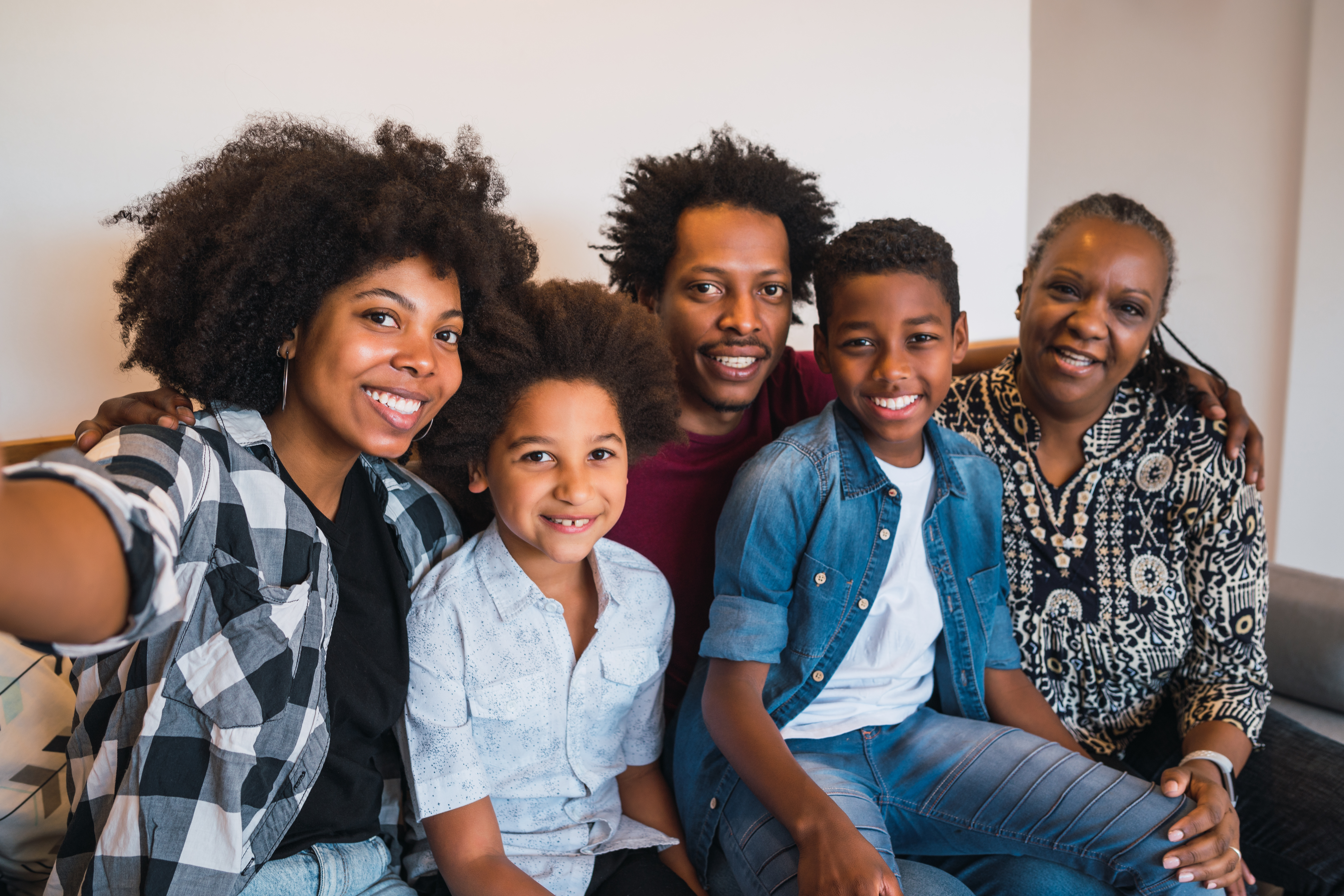 Portrait of african american multigenerational family taking a selfie together at home. Family and lifestyle concept.