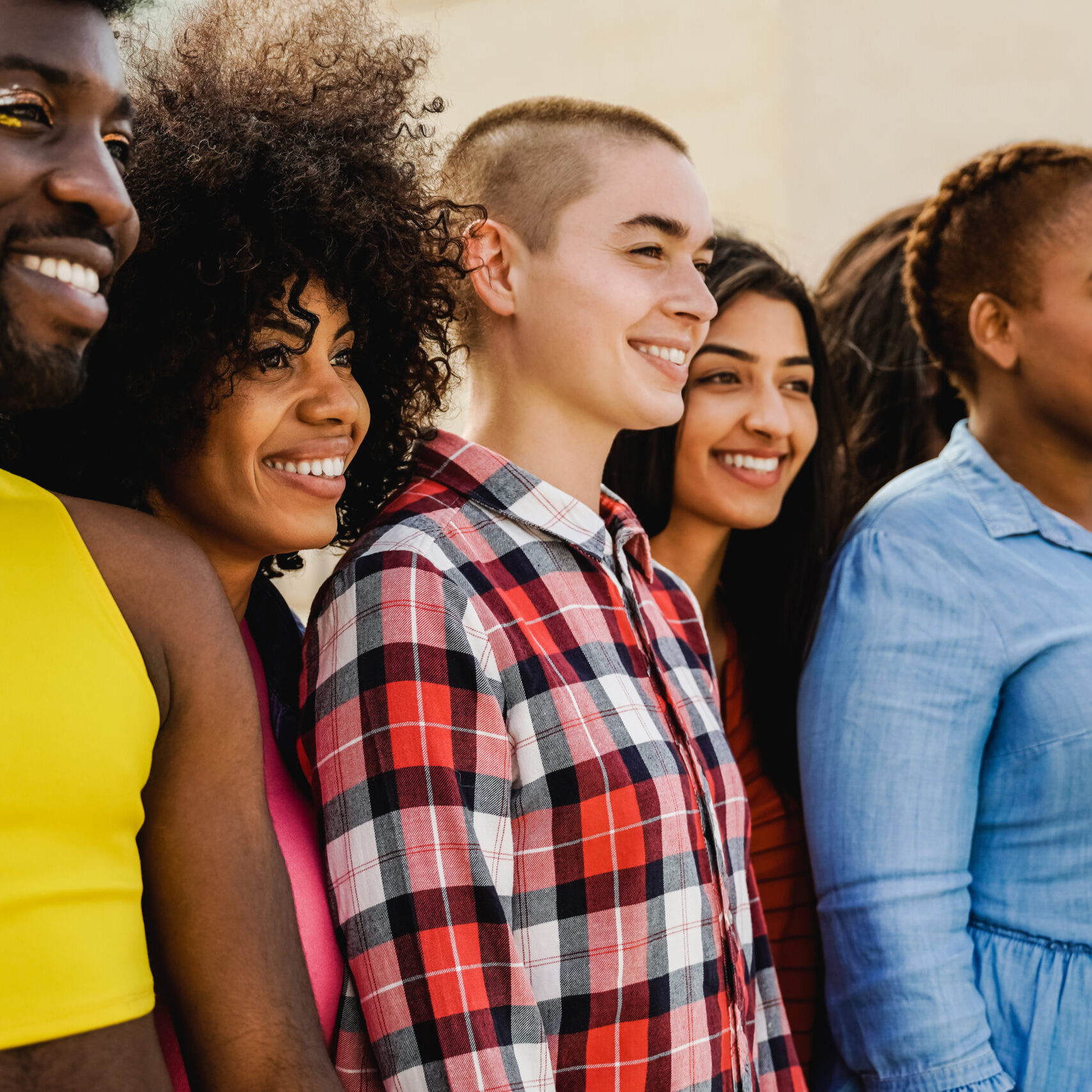 Multiethnic diverse group of people having fun outdoor - Focus on African girl face - Diversity and youth concept Multiethnic diverse group of people having fun outdoor - Focus on African girl face - Diversity and youth concept
